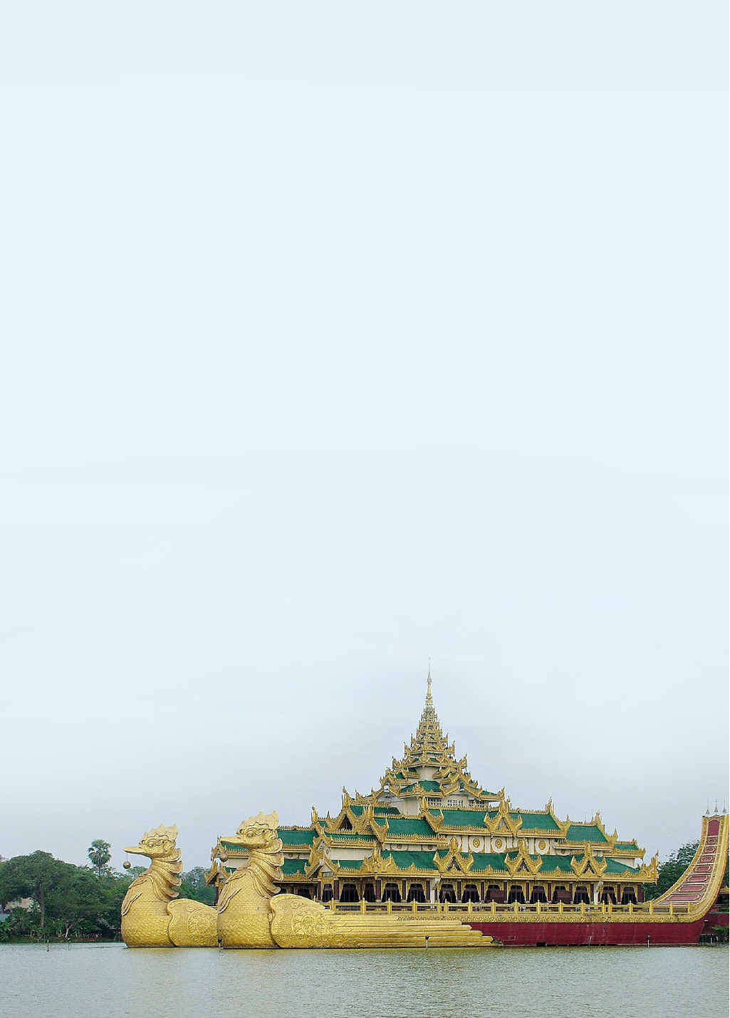 The Karaweik Bird Barge restaurant was built in the 1970s according to the design of the royal barges used by Myanmar kings. It sits on the Kan Daw Gyi lake in Rangoon. The Karaweik Bird Barge restaurant was built in the 1970s according to the design of the royal barges used by Myanmar kings. It sits on the Kan Daw Gyi lake in Rangoon.